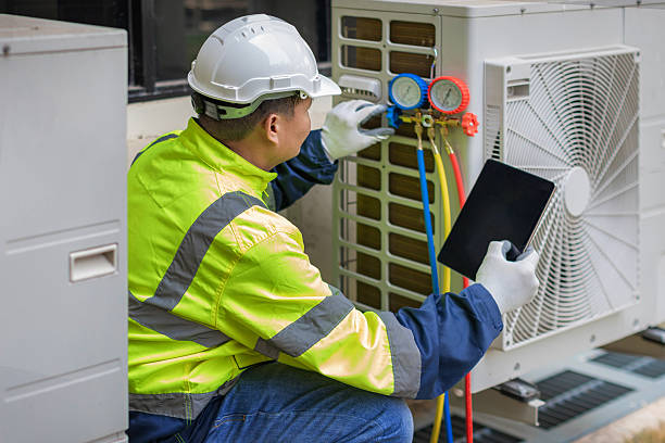 Professional Air Duct Cleaning technician working in West Islip, NY